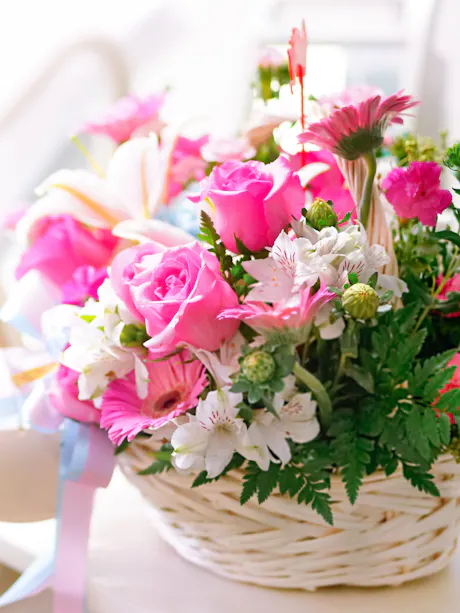 Bright get well flower basket with pink roses, gerbera daisies, white lilies, alstroemeria,, and greenery